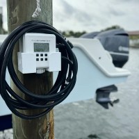 MarineWarehouse/Flushmaster-2-Outlet-Automated-Outboard-Flushing-System-installed-on-a-dock__89051.1739477312