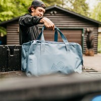 MarineWarehouse/Man-loading-a-Steel-Blue-Mission-CASSI-58L-Duffel-Tote-in-a-truck-bed__34851.1739477272