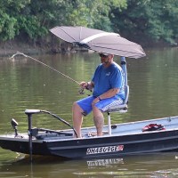 MarineWarehouse/TACO-Marine-ShadeFin-Installed-on-bass-boat-with-man-fishing__55955.1739477129