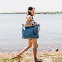 MarineWarehouse/Woman-Walking-Down-The-Beach-With-A-Steel-Blue-Mission-Cassi-33L-Beach-Tote__83850.1739477270