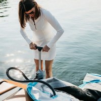 MarineWarehouse/Woman-using-manual-pump-to-inflate-Mission-Reef-Lite-Splash-Inflatable-Water-Mat__29981.1739477079